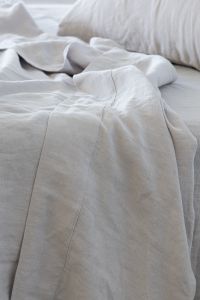 100% French flax linen whisper white sheet set on a bed